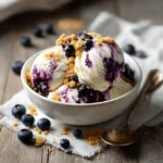 Blueberry Cheesecake Cottage Cheese Ice Cream Recipe 5 Blueberry cheesecake cottage cheese ice cream in a rustic bowl
